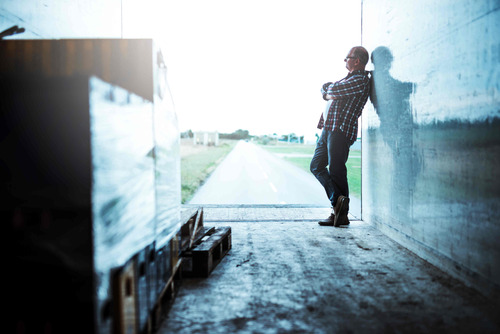 Man leaning against truck